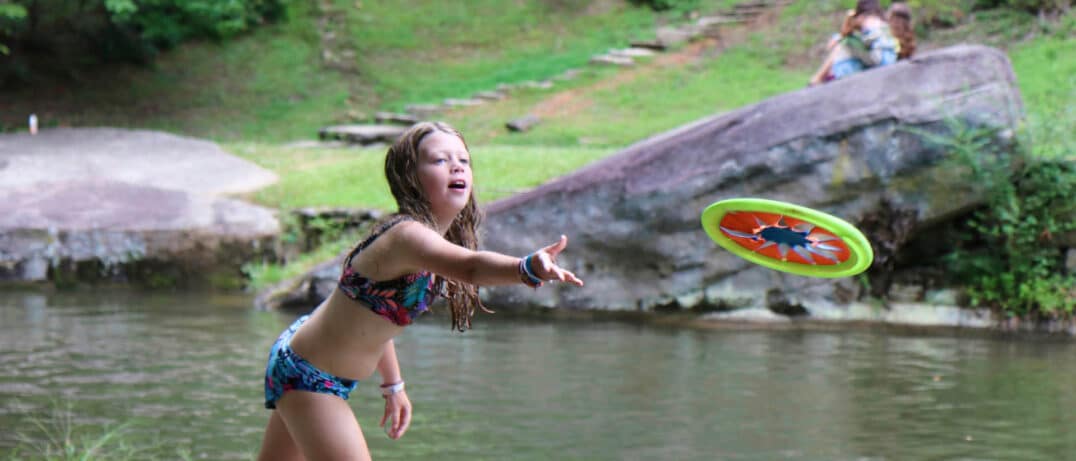 tossing water toy girl