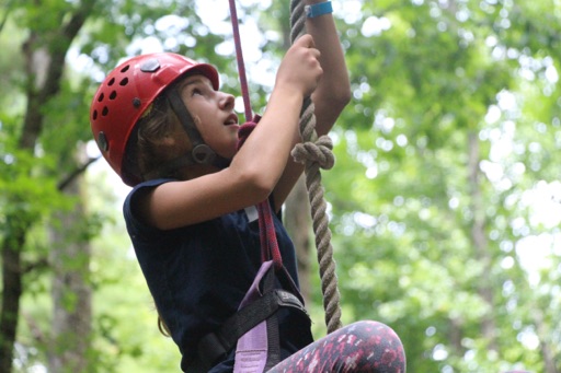 girls climbing rope tower