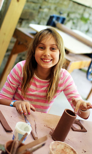 Ceramics Camp girl with clay