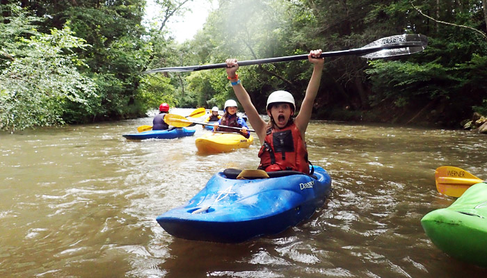 girls kayaking celebration