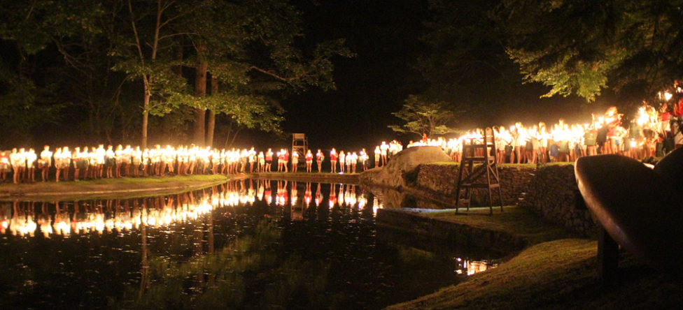 camp spirit candle ceremony around lake