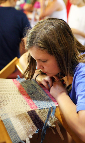 Weaving camp girls with loom