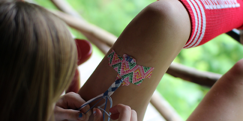 Bracelet making taped to leg