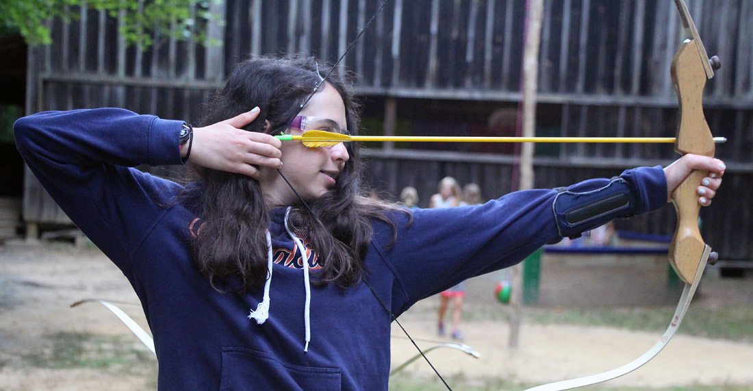 Girl Archer at camp