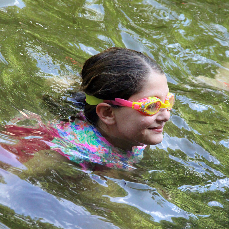 Girl swimming with goggles