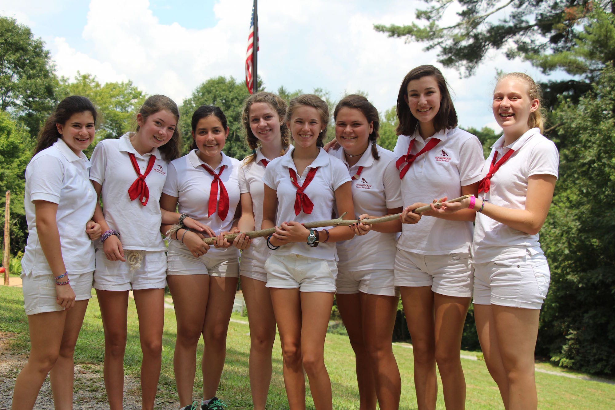 camp girls holding award