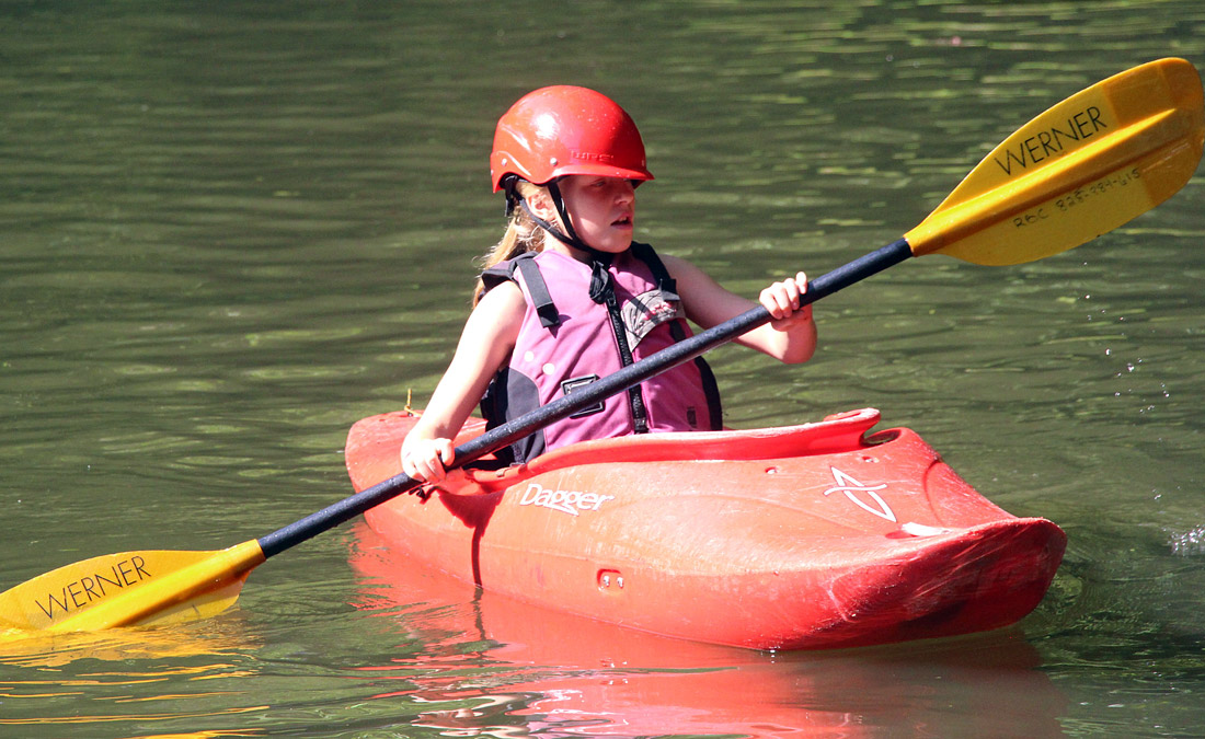 Small child kayaking camp