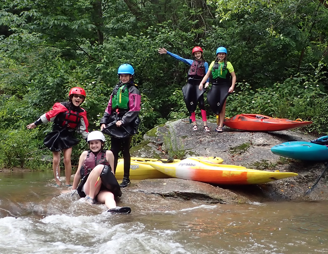 Girls kayaking camp fun in the rain