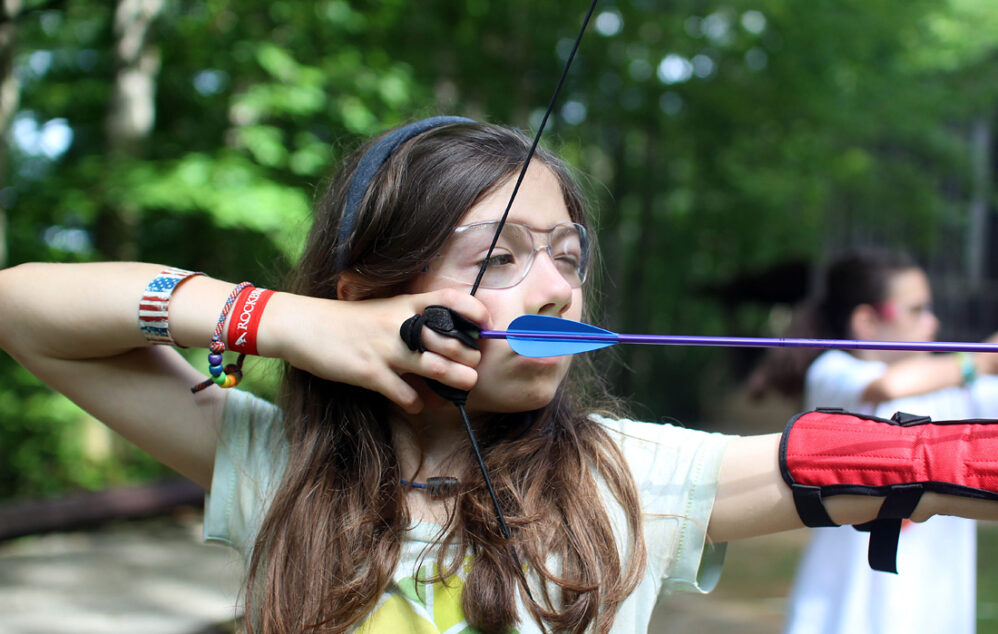 Camp archery girl pulling