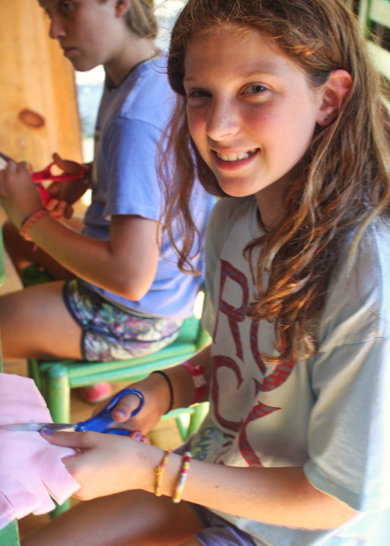 girl making tie pillow