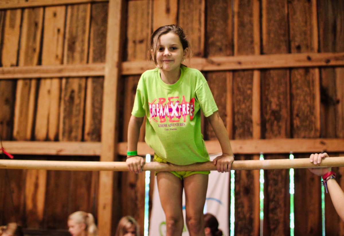 gymnastics kid on high bar