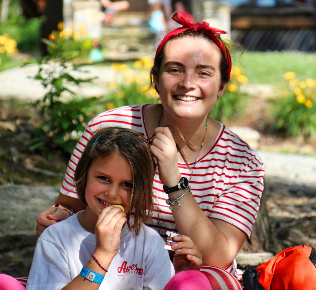 female camp counselor and girl