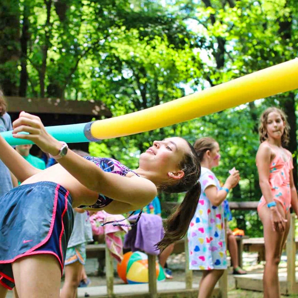 camp girl doing limbo