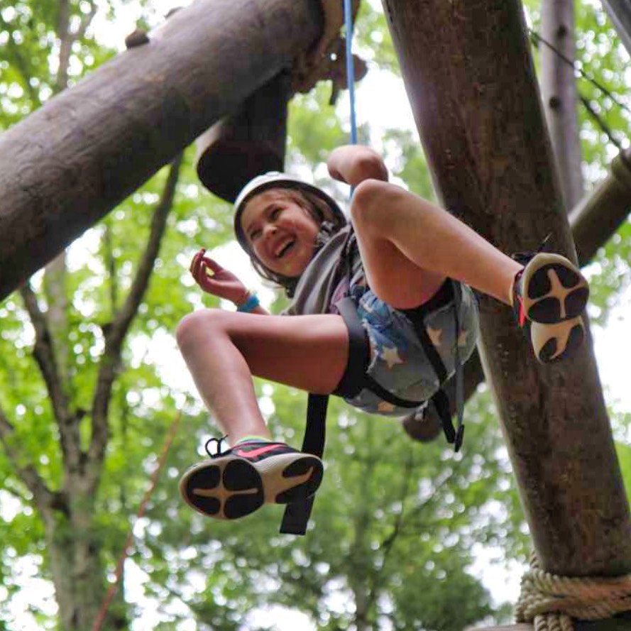 camp girl descending rope