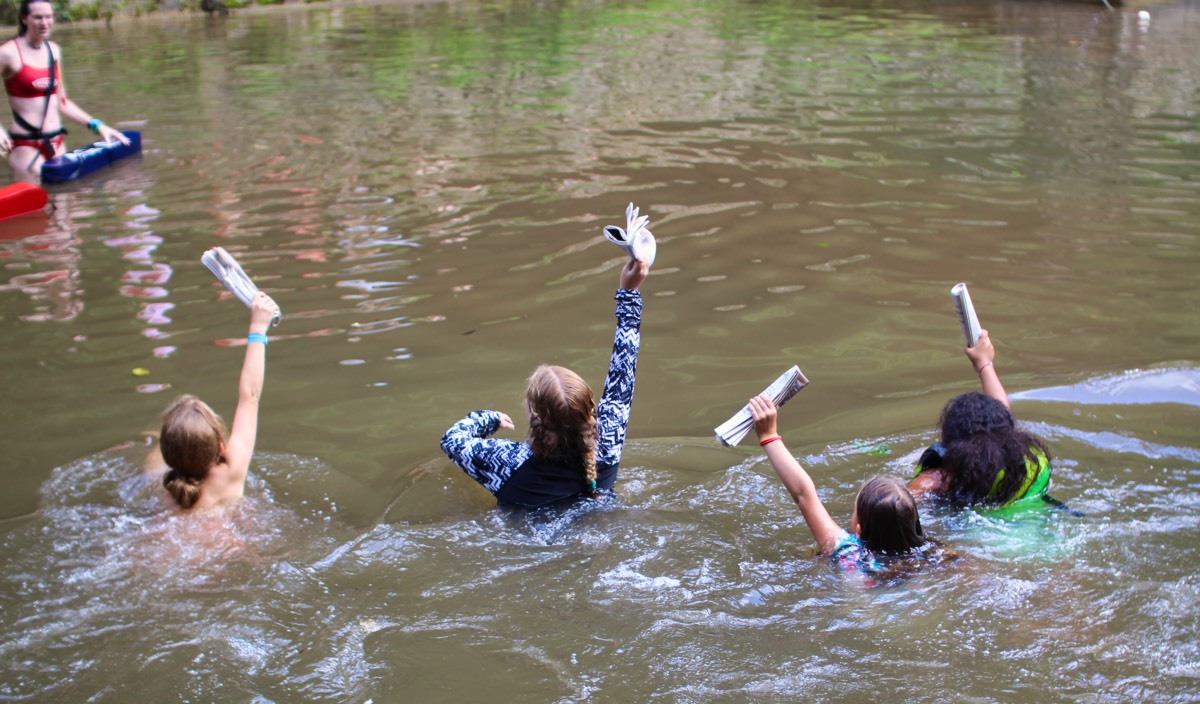 newspaper swimming relay race