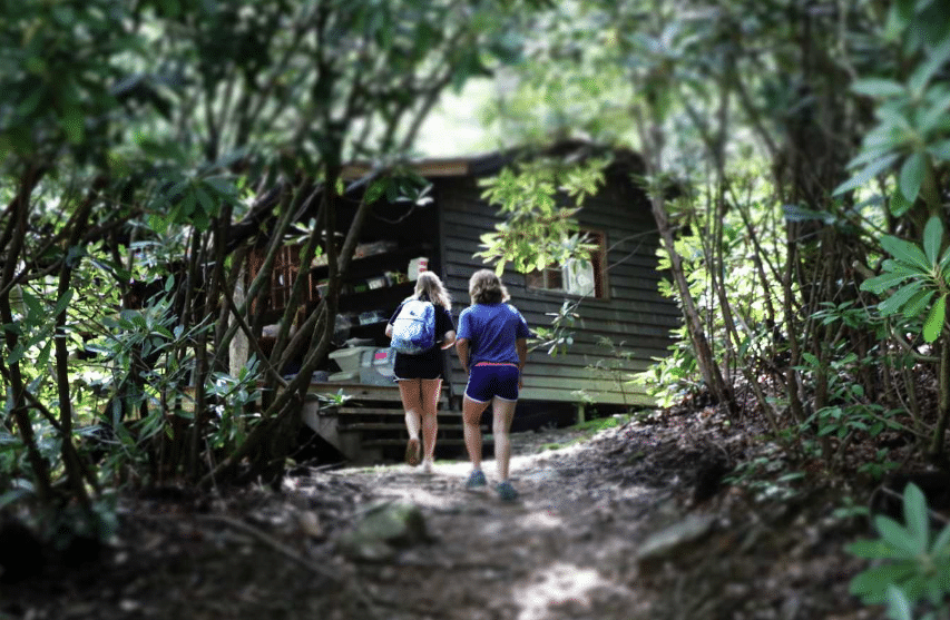 Campers walking through the woods