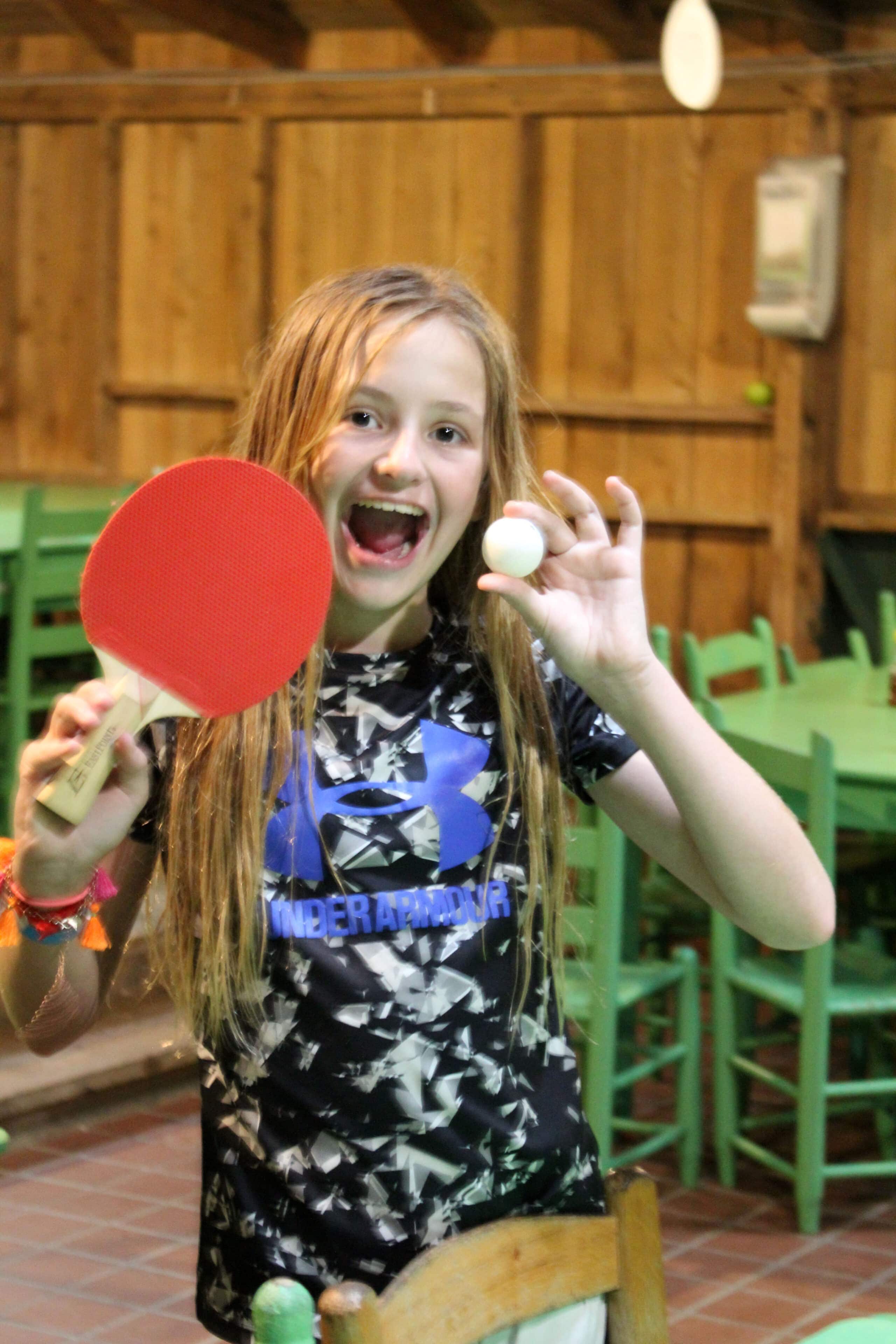 Camp Girl with ping pong paddle and ball