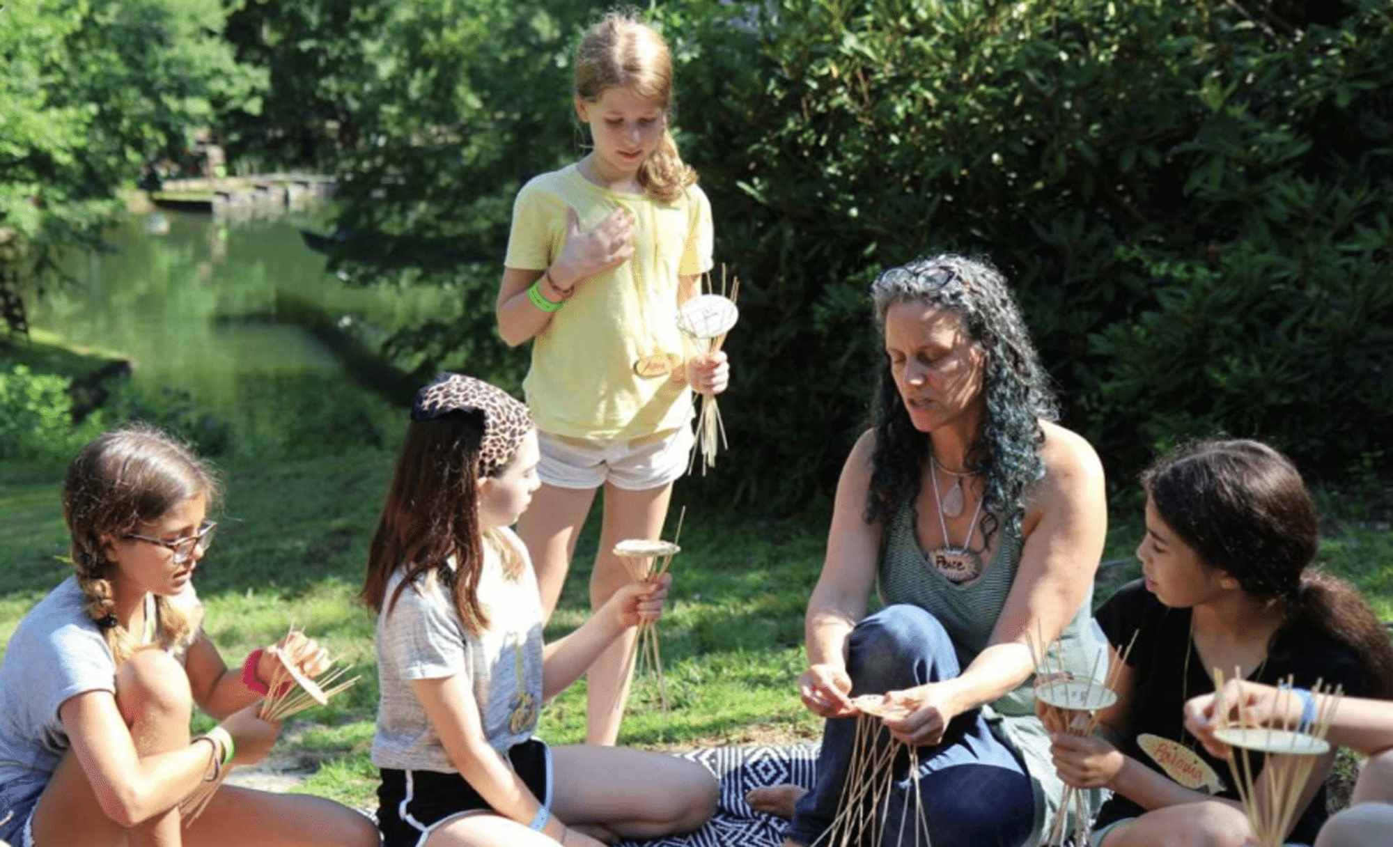 teaching weaving by the creek