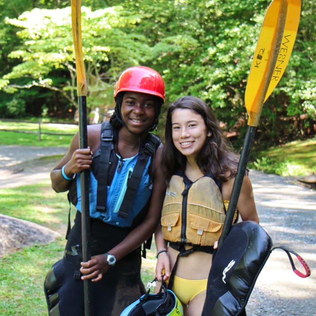 two adventure girls with gear