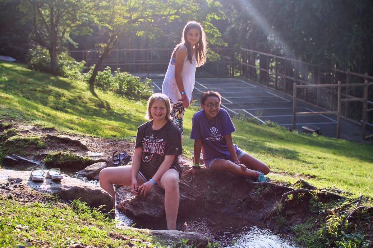 kids playing outdoors at summer camp