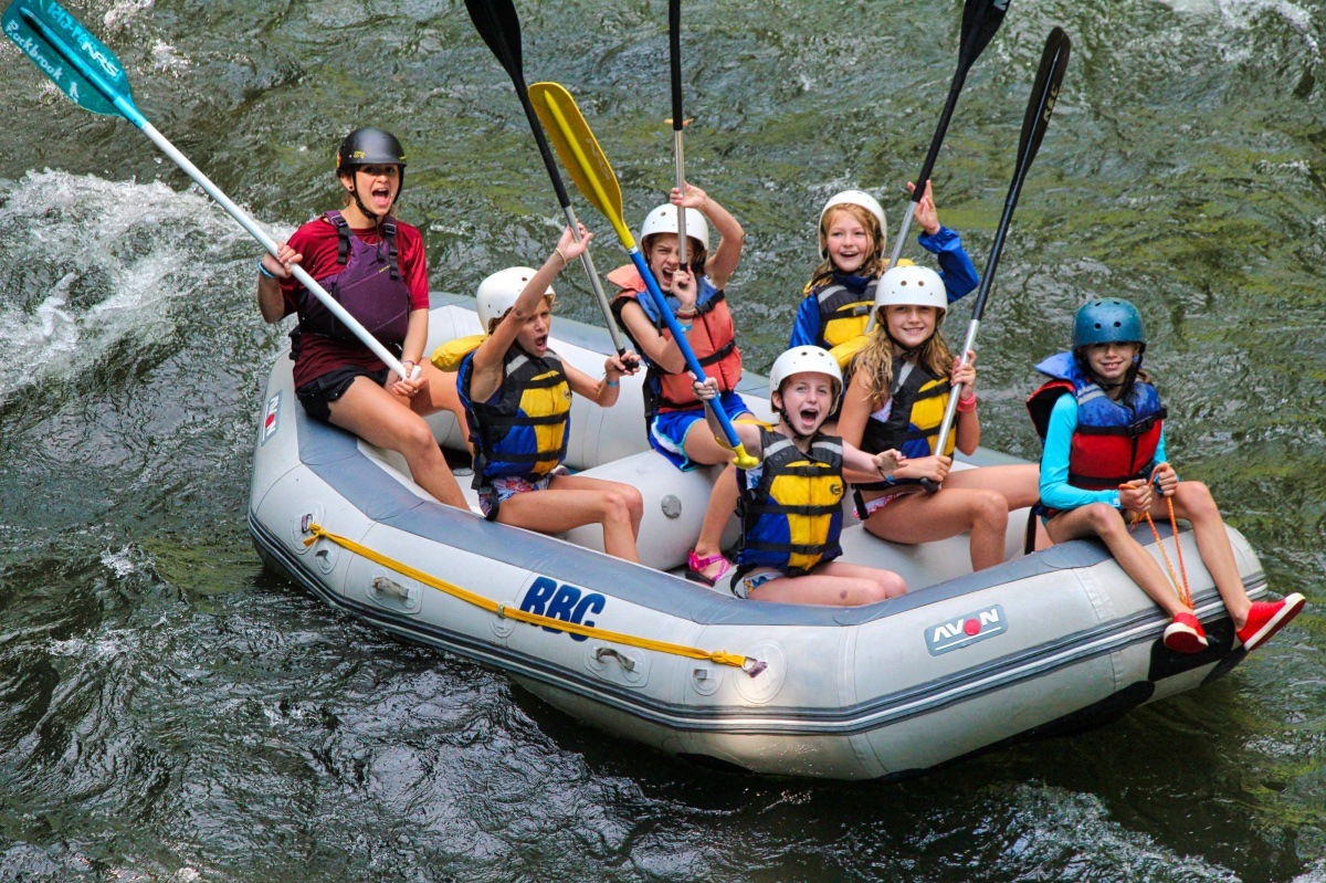 whitewater rafting boat cheering