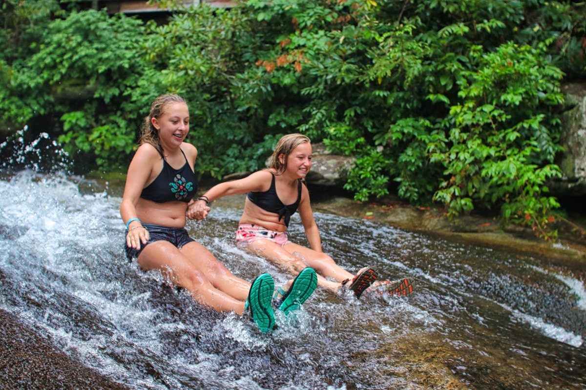 friends going down sliding rock