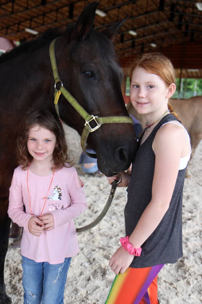 two girls with horse