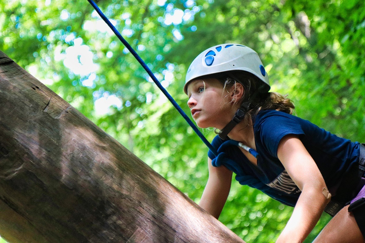 climbing girl dressed in blue