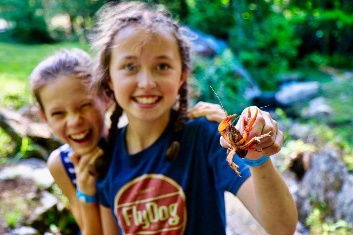 camp girl holding crayfish