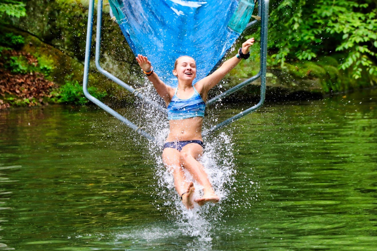 camp girls emerging from water slide