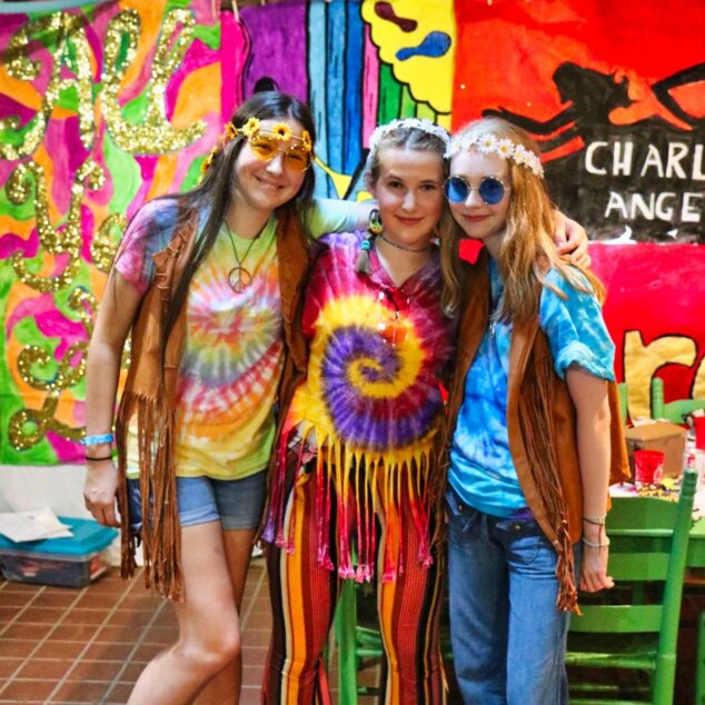 teen girls dressed in 1970s outfits