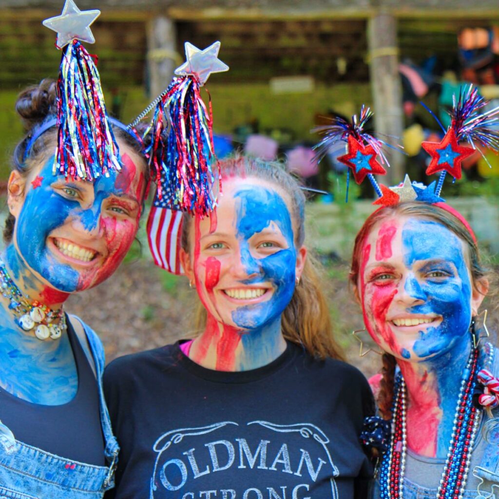camp counselors painted red white and blue for 4th of July
