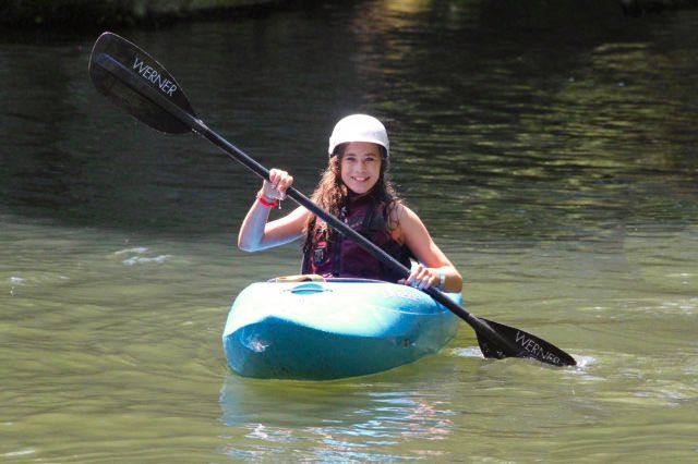 learning to kayak at summer camp