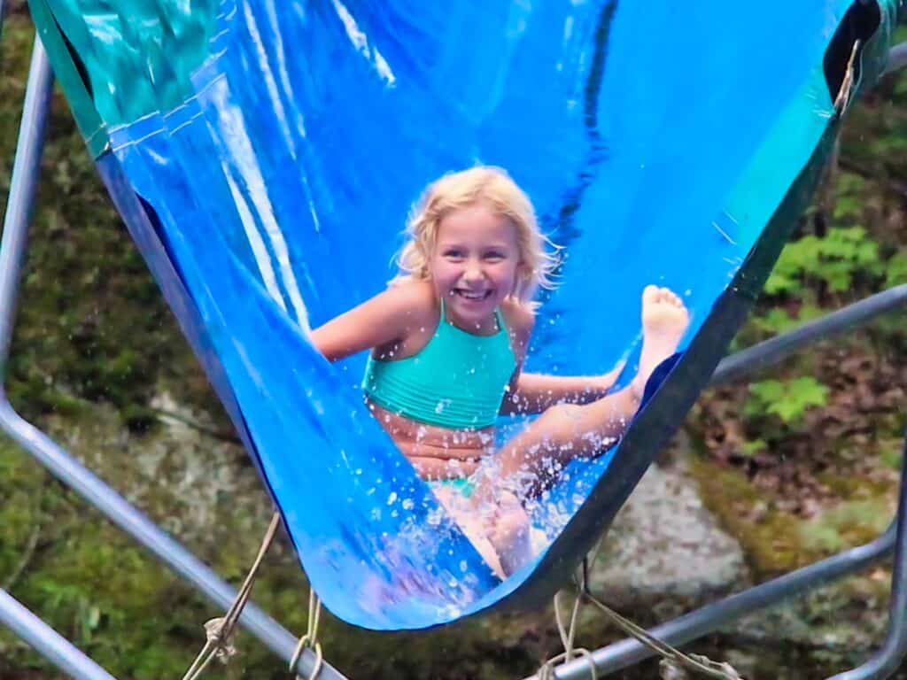 little camp girl on water slide