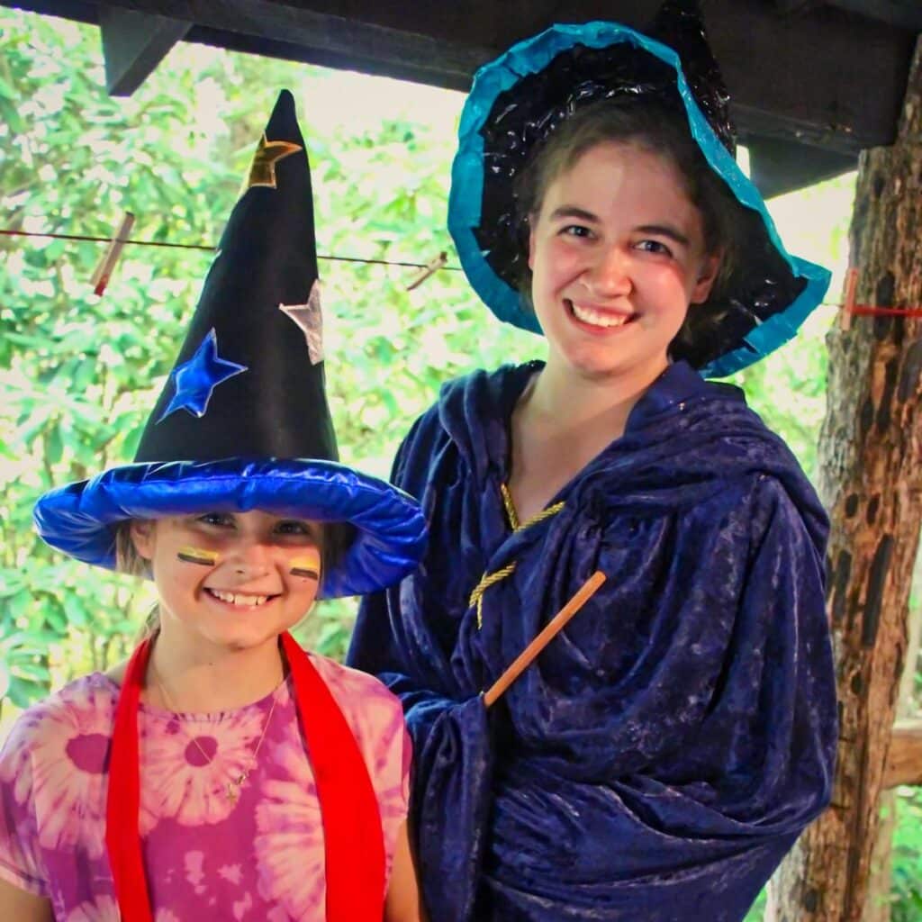 camp counselor and camper dressed in wizard costume