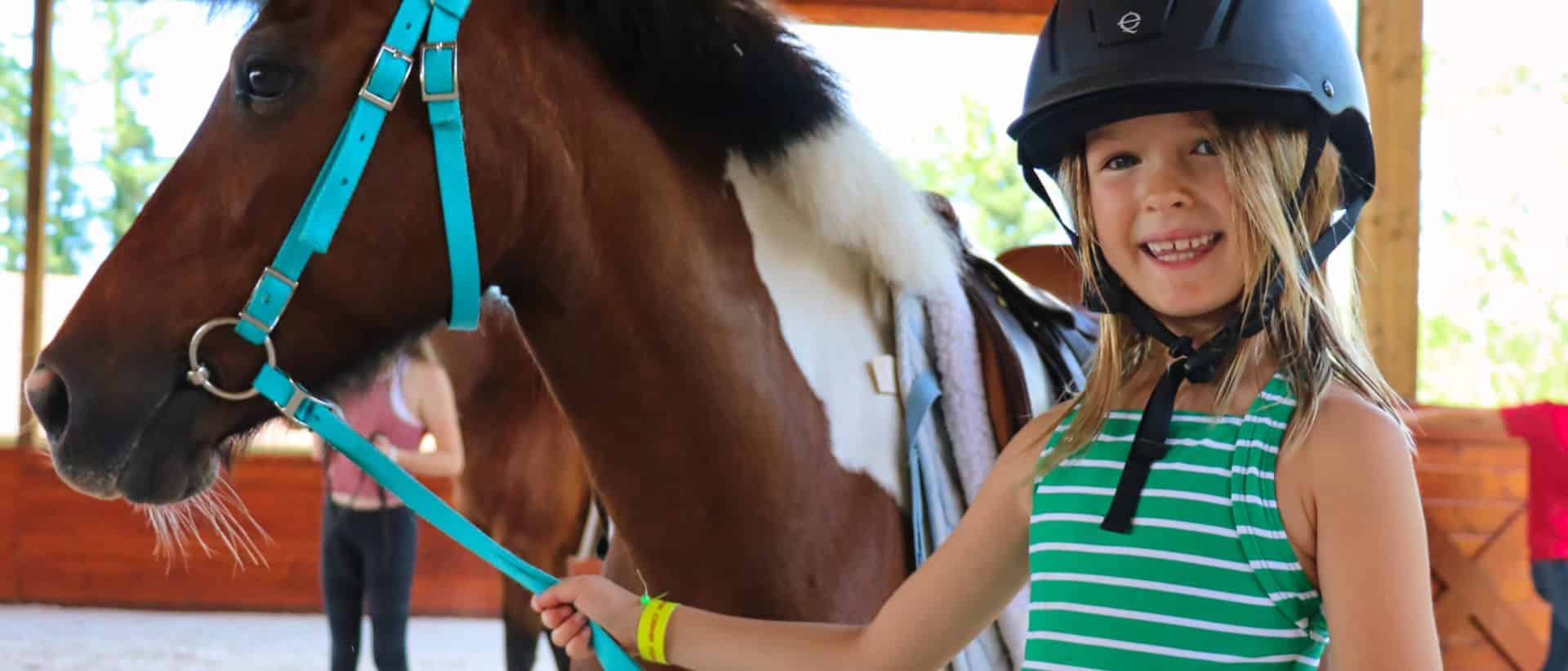 young equestrienne at camp