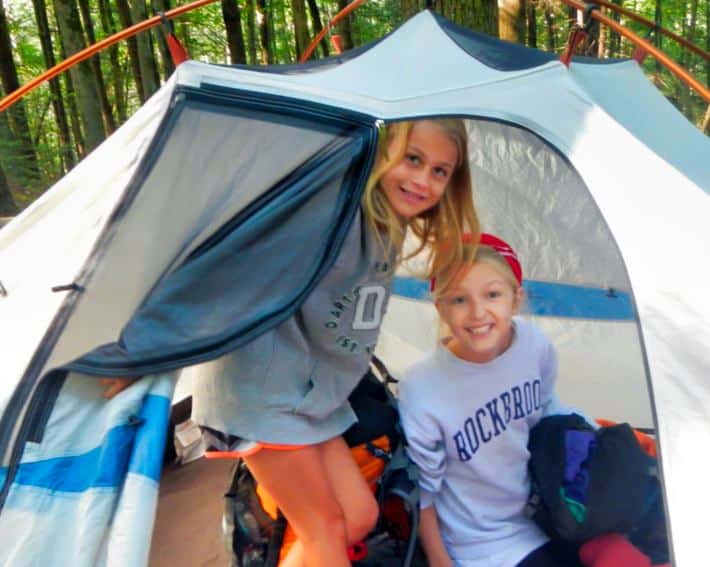 girls inside camping tent