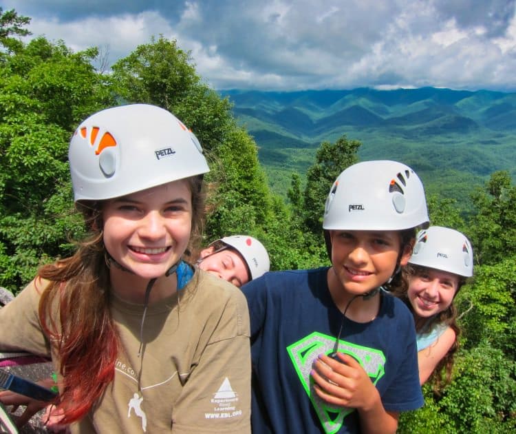 group of girls friends rock climbing