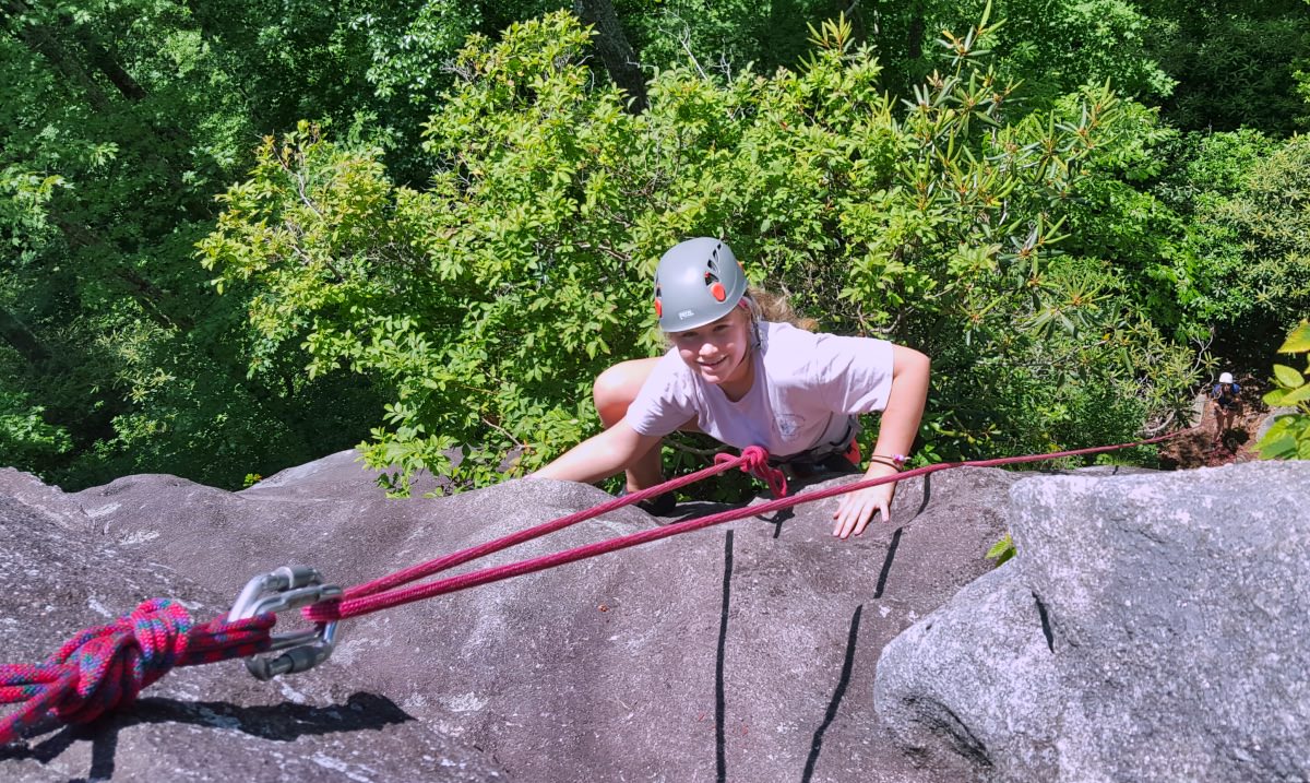 girl top rope climbing