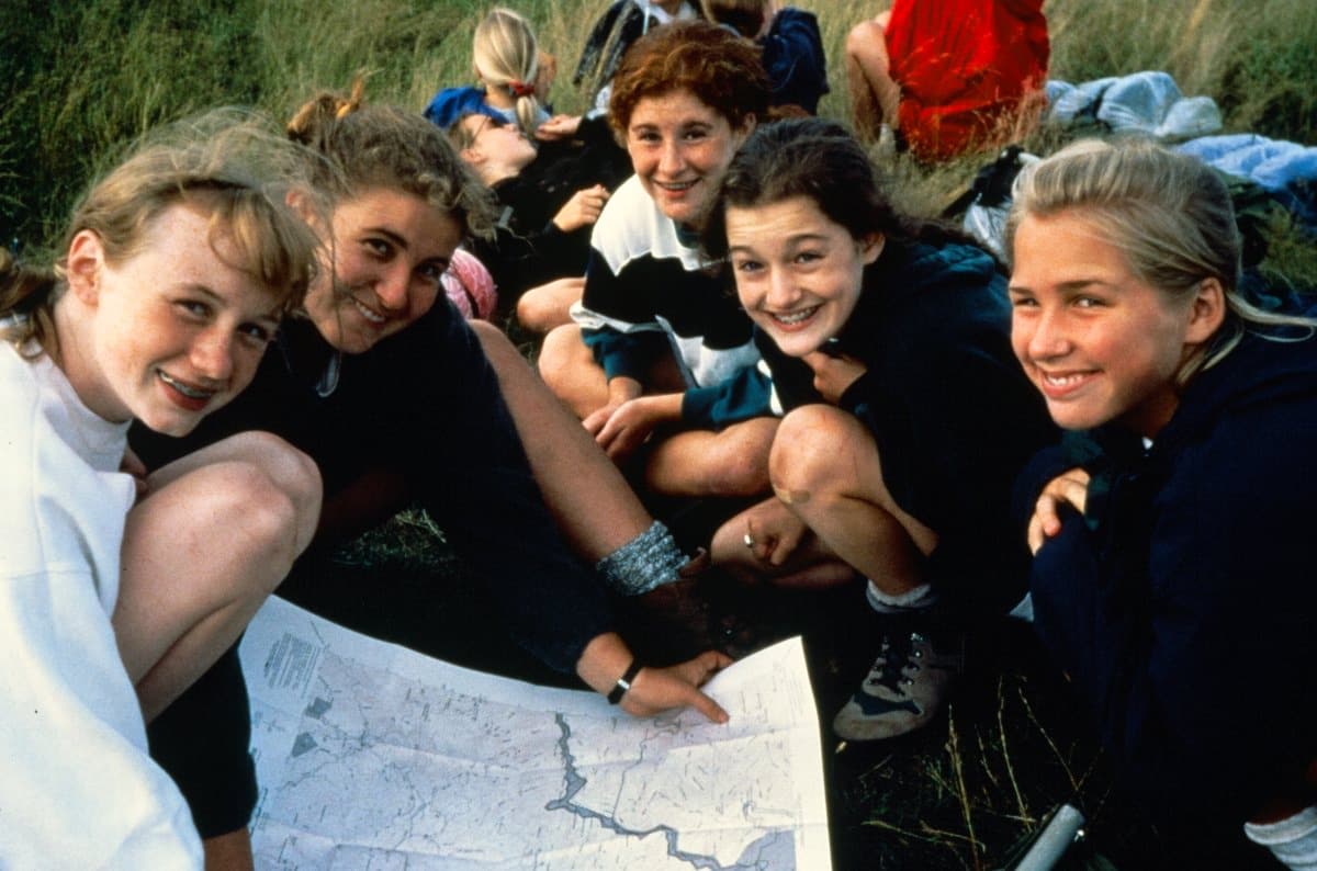 camp kids reading a map on hike