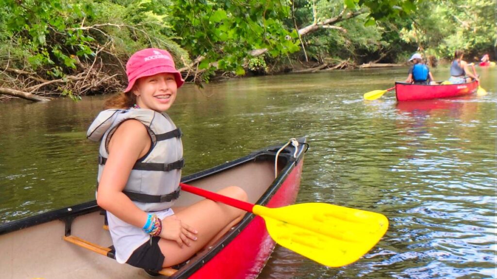 camp girl canoeing trip on French Broad