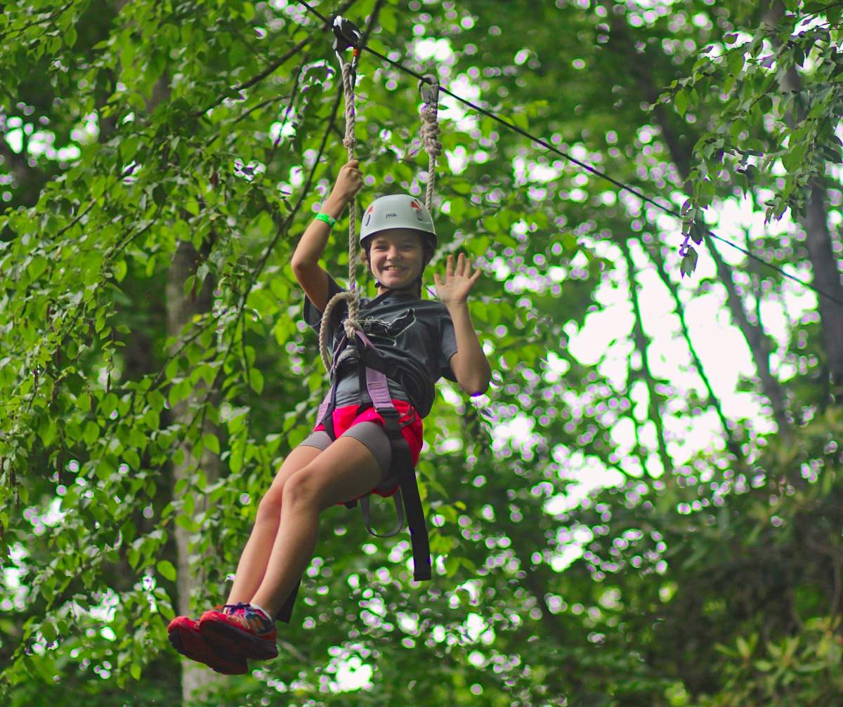 camp girl zipping by