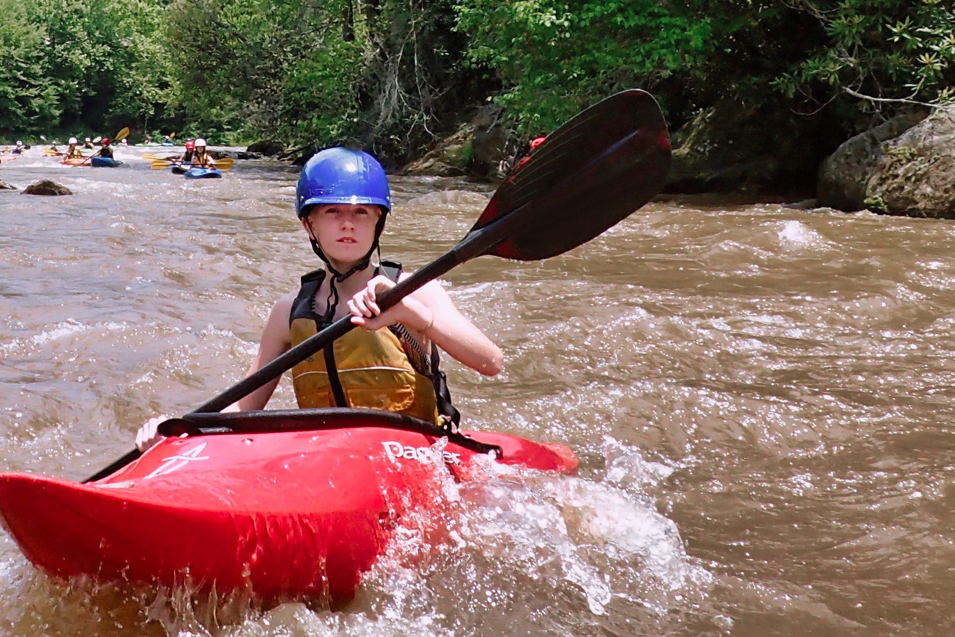 kid kayaking whitewater rive