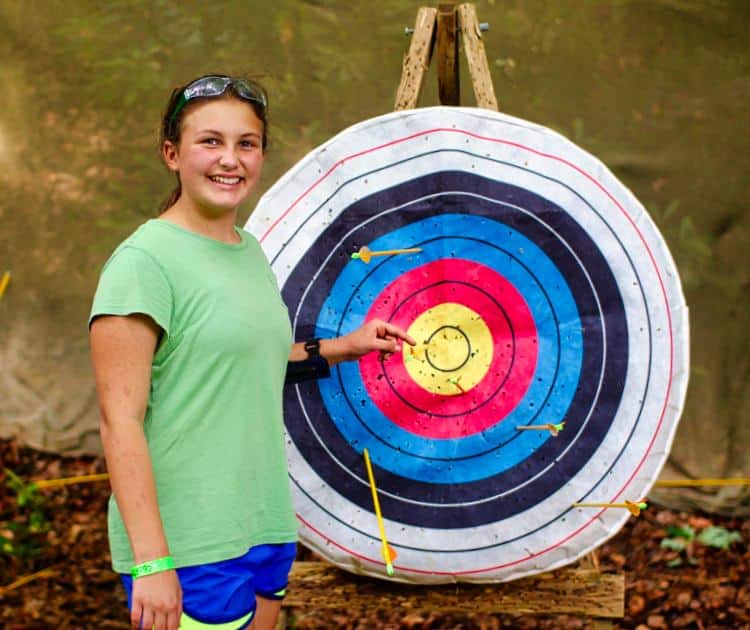 girl with bullseye archery target