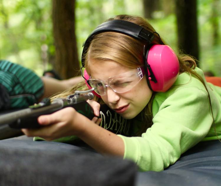 summer camp rifle marksman girl