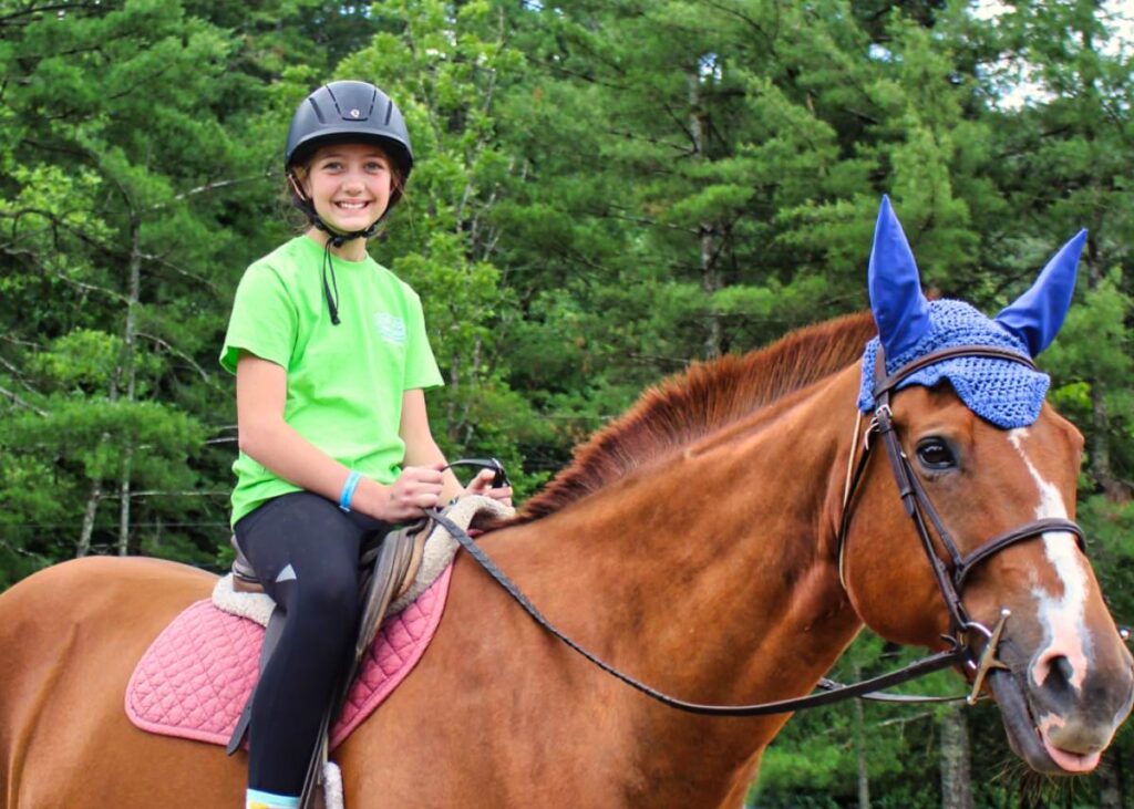 overnight summer camp kid on horseback