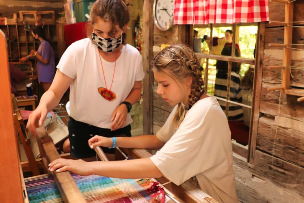 teaching weaving at summer camp