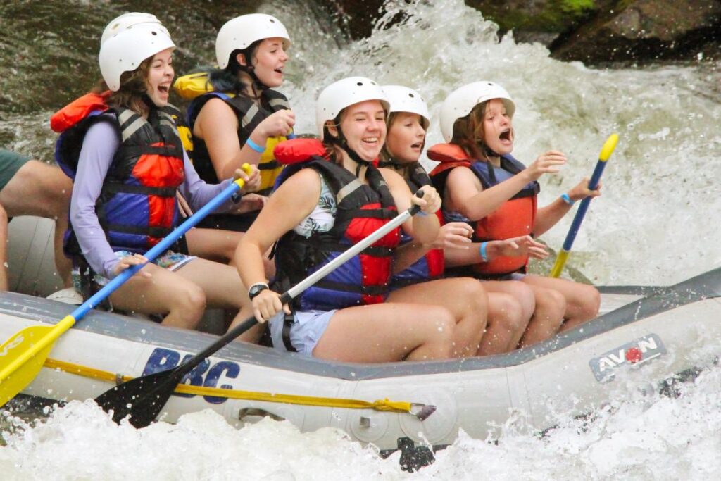 girls whitewater rafting splash