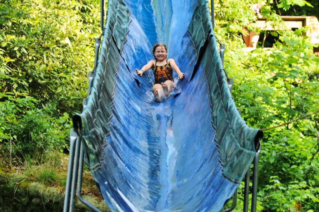 Waterslide child at summer camp