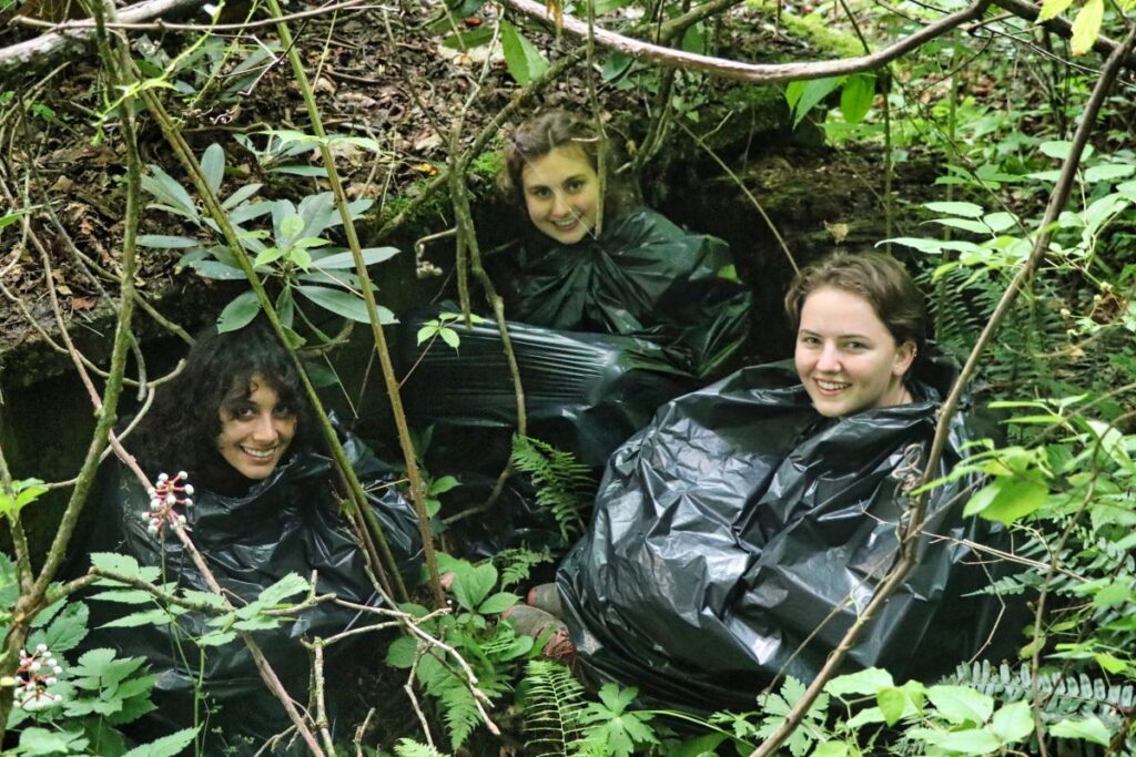 camp counselors hiding in bushes